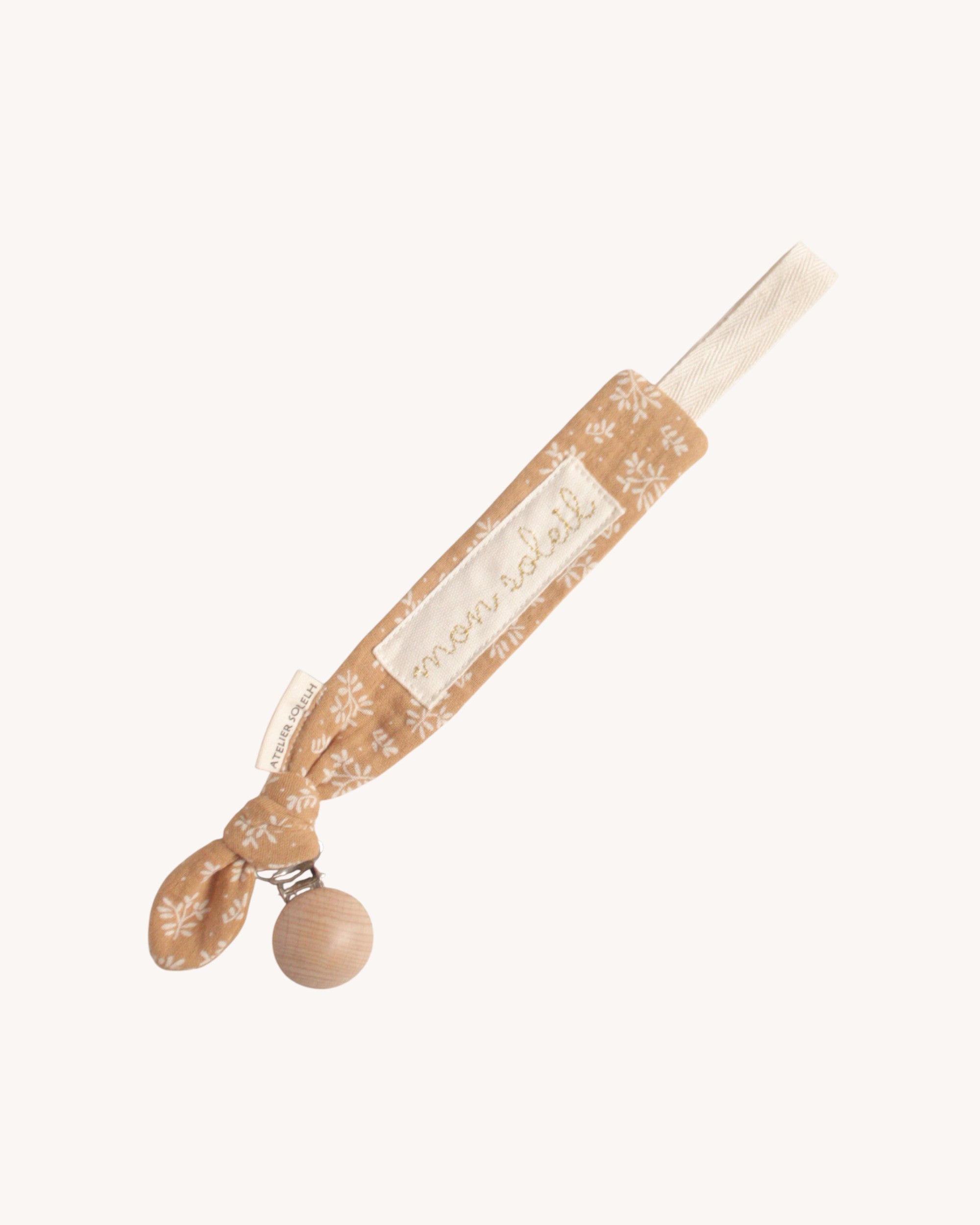 Attache-tétine personnalisé feuillage biscuit